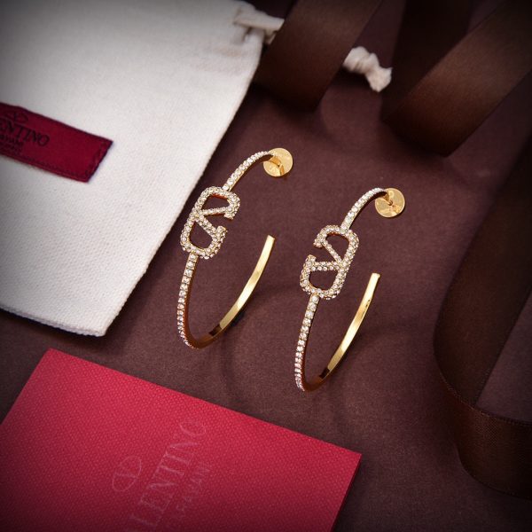 The new Valentino Valentino is stylish and versatile with gold stud earrings